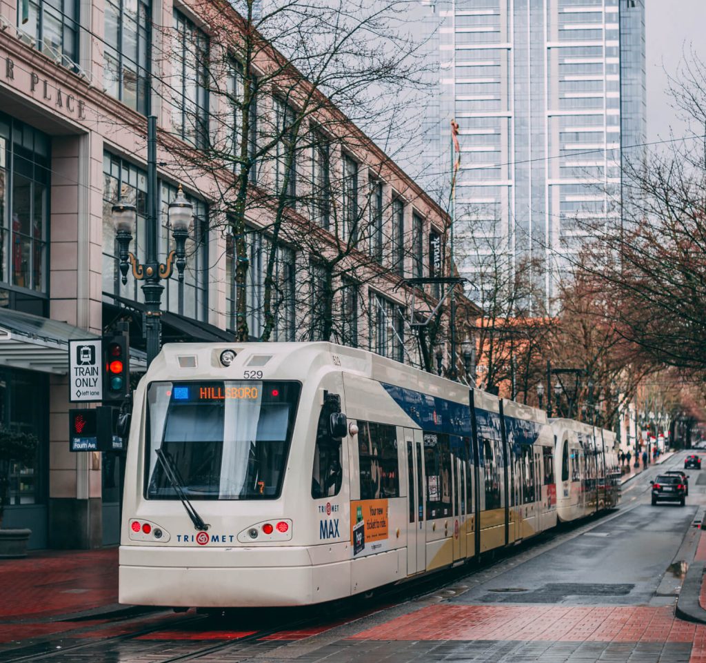 City train in downtown Portland on an overcast day.