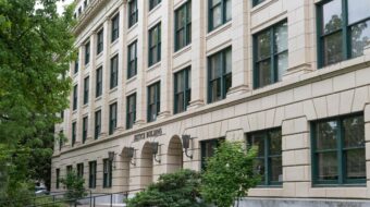 OR justice building taken from a front angled view with trees off to the side